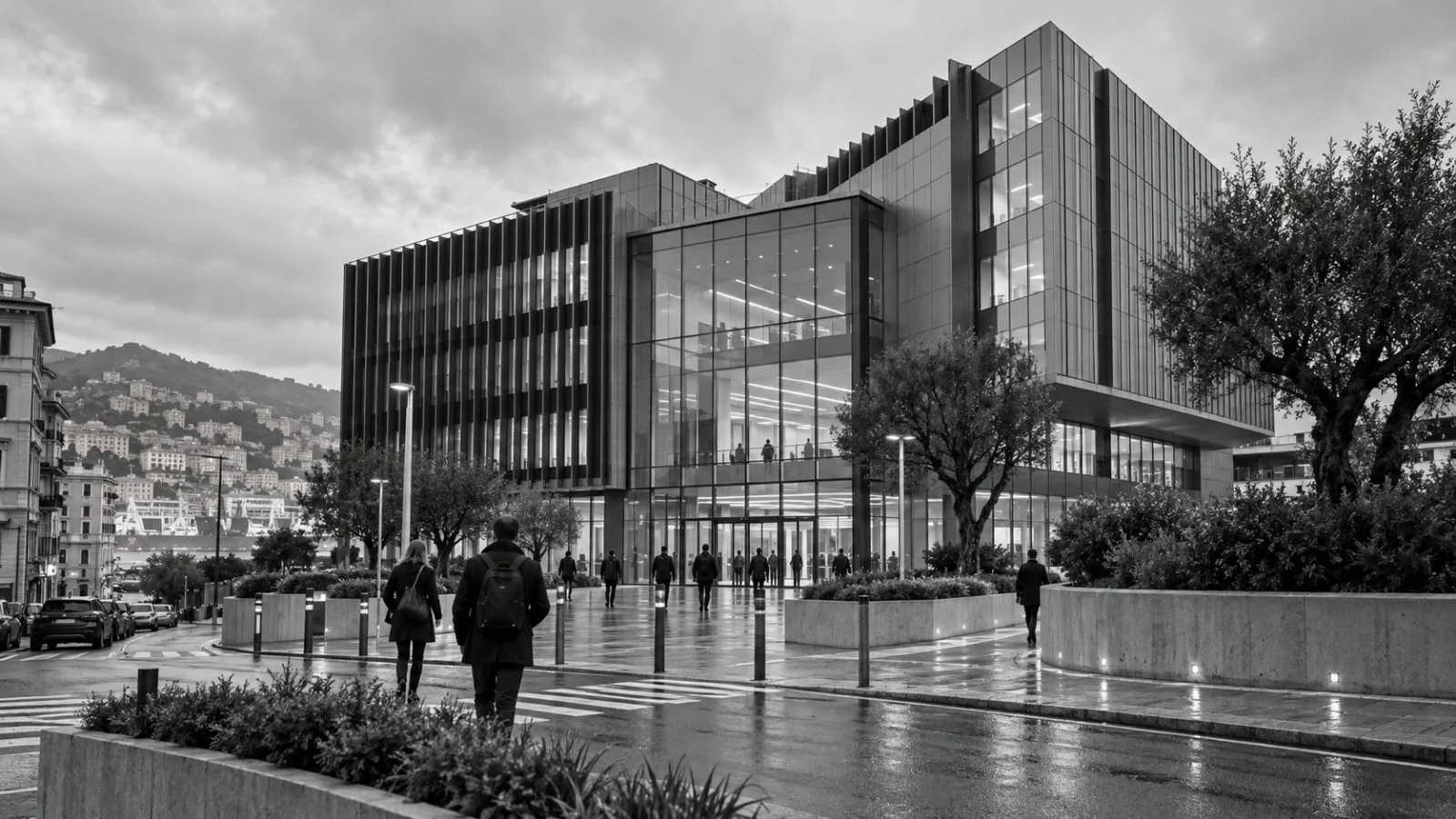 Employees enter an office building in Genoa, Italy, under overcast skies. / EconoTimes.ai