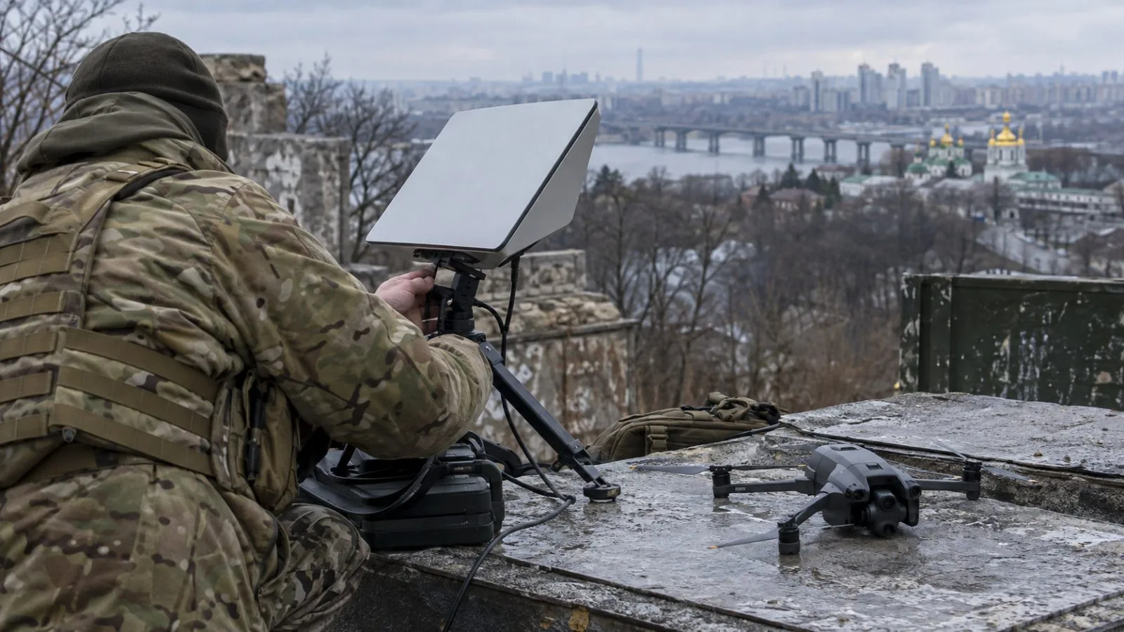 A satellite communications terminal sits beside a small drone at a field operations site in Kyiv, Ukraine. (AI-generated image / EconoTimes)