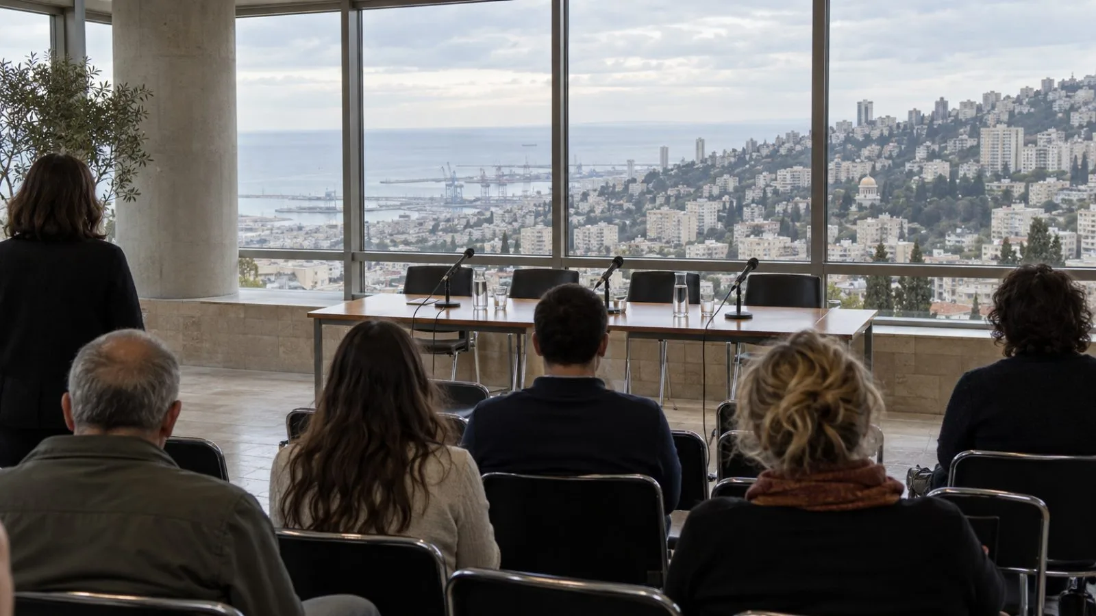 Attendees face a table of microphones at a news conference in Haifa, Israel. (AI-generated image / EconoTimes)