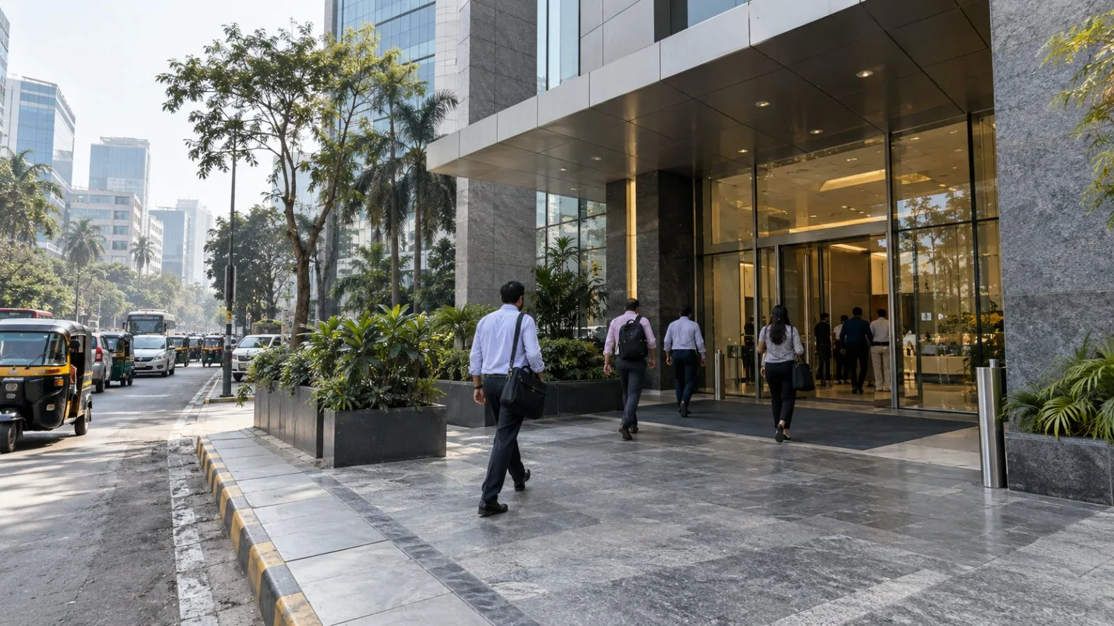 Employees enter the Natraj building in Andheri East, Mumbai, on a hazy morning. (AI-generated image / EconoTimes)