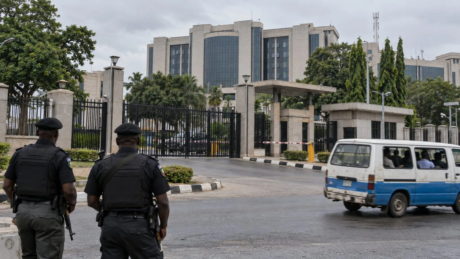 A police compound gate stands on a quiet street in Abuja, Nigeria (AI-generated image / EconoTimes)