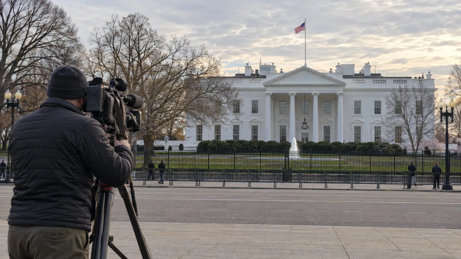 A camera operator films the White House from Pennsylvania Avenue in Washington, D.C. (AI-generated image / EconoTimes)