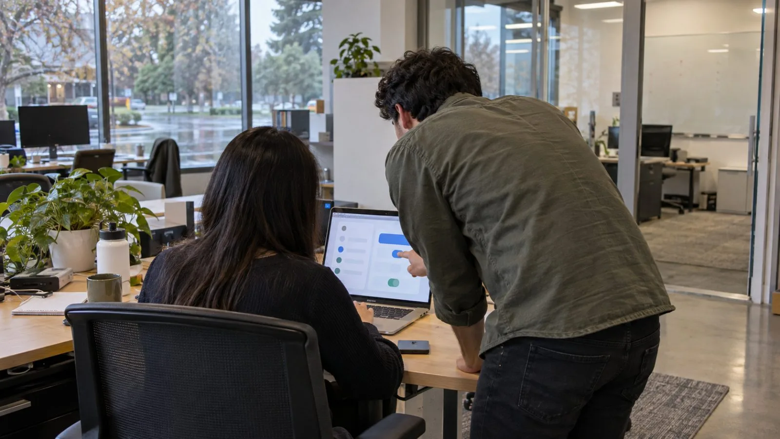 An anonymous visitor enters a glass office building in Palo Alto, California. / EconoTimes.ai