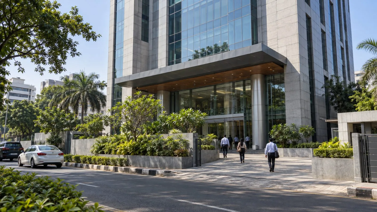 Office workers enter Harita Towers on St. Mary’s Road in Chennai, India. (AI-generated image / EconoTimes)