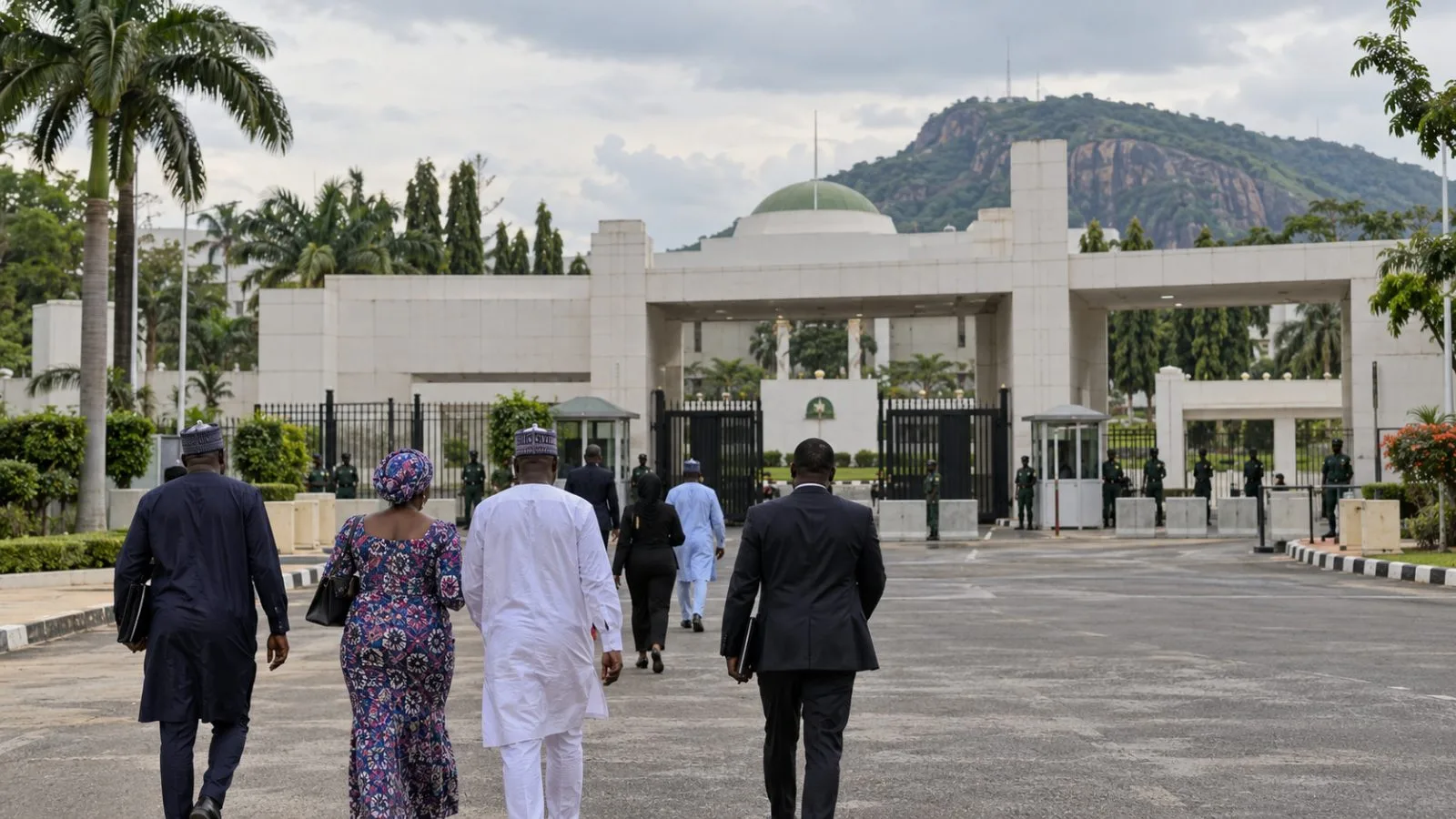 Young attendees approach the State House entrance in Abuja, Nigeria. (AI-generated image / EconoTimes)
