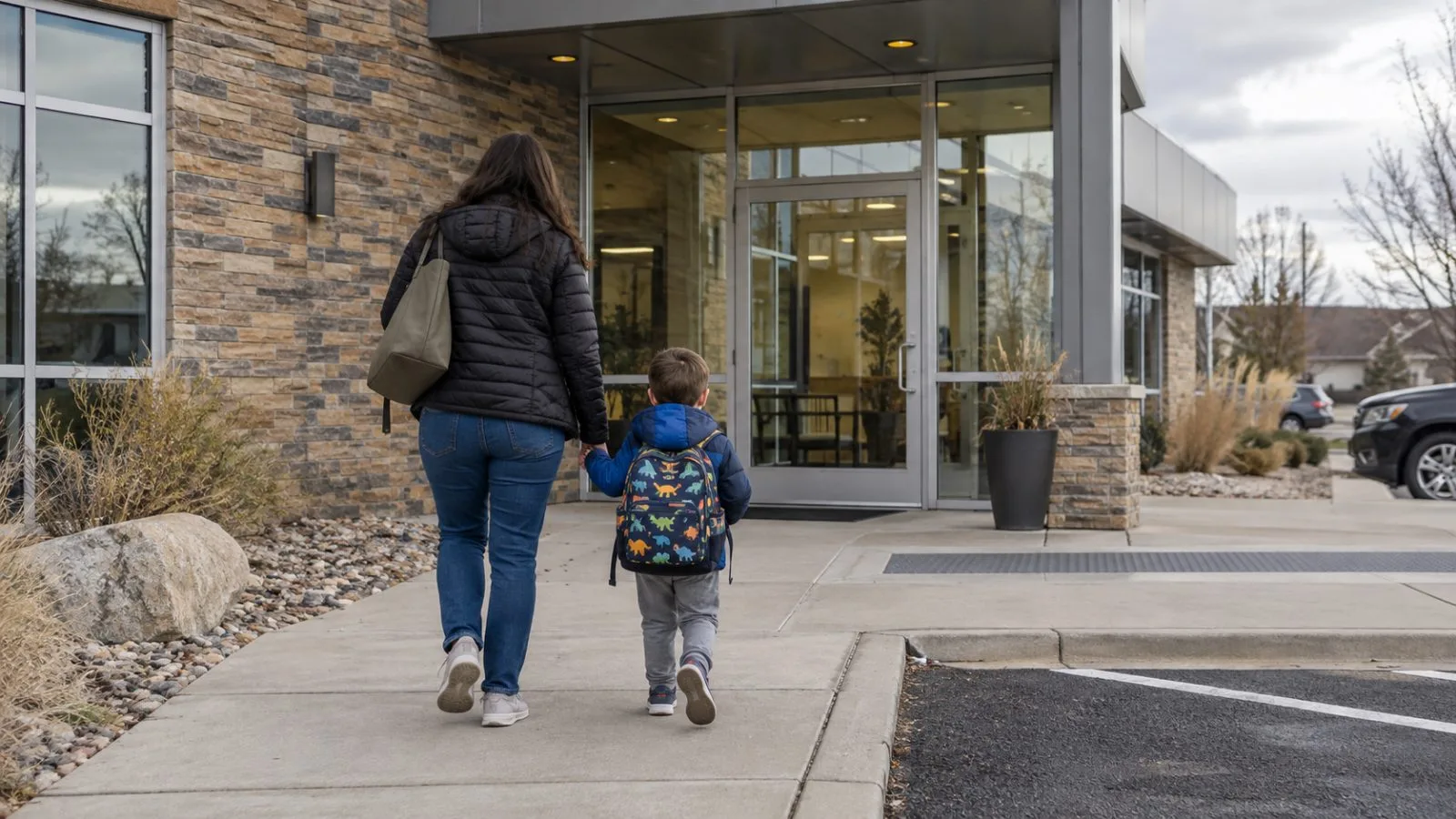 An adult and child approach a therapy center in Denver, Colorado, on an overcast morning. (AI-generated image / EconoTimes)