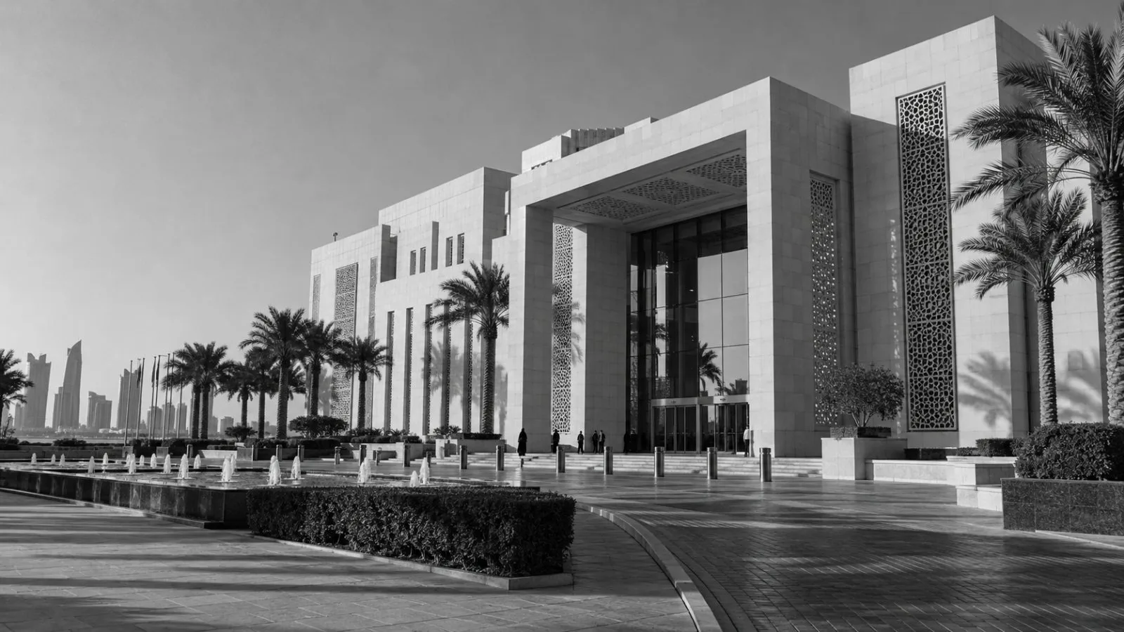Visitors pass Qatar's Ministry of Foreign Affairs in afternoon light in Doha. (AI-generated image / EconoTimes)