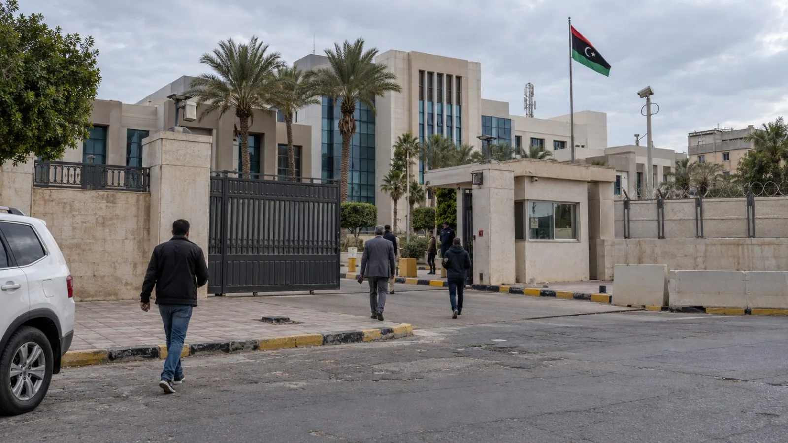Pedestrians pass the electoral commission compound in Tripoli, Libya. (AI-generated image / EconoTimes)