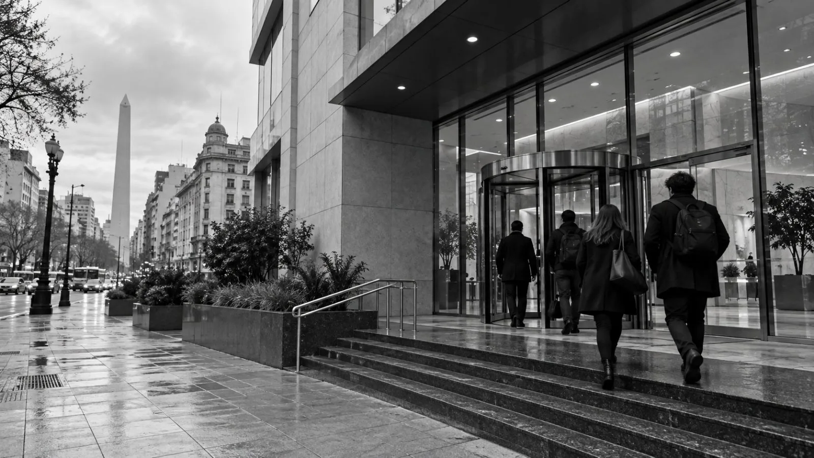 Staff enter an office building in Buenos Aires, Argentina, on an overcast morning. / EconoTimes.ai