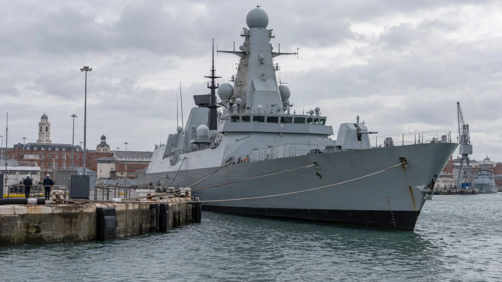A Royal Navy frigate is moored at HM Naval Base Portsmouth in England. / EconoTimes.ai