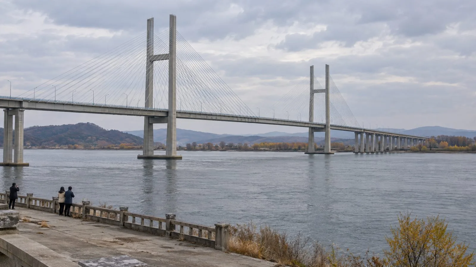 The New Yalu River Bridge spans the Yalu River near Dandong, China. (AI-generated image / EconoTimes)