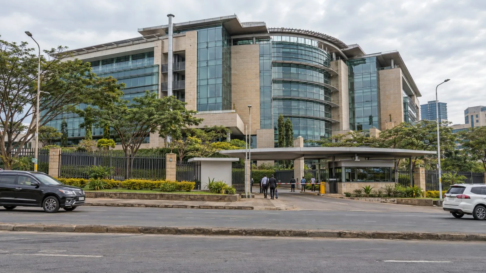 Staff enter Safaricom House in Nairobi, Kenya, on an overcast morning. (AI-generated image / EconoTimes)