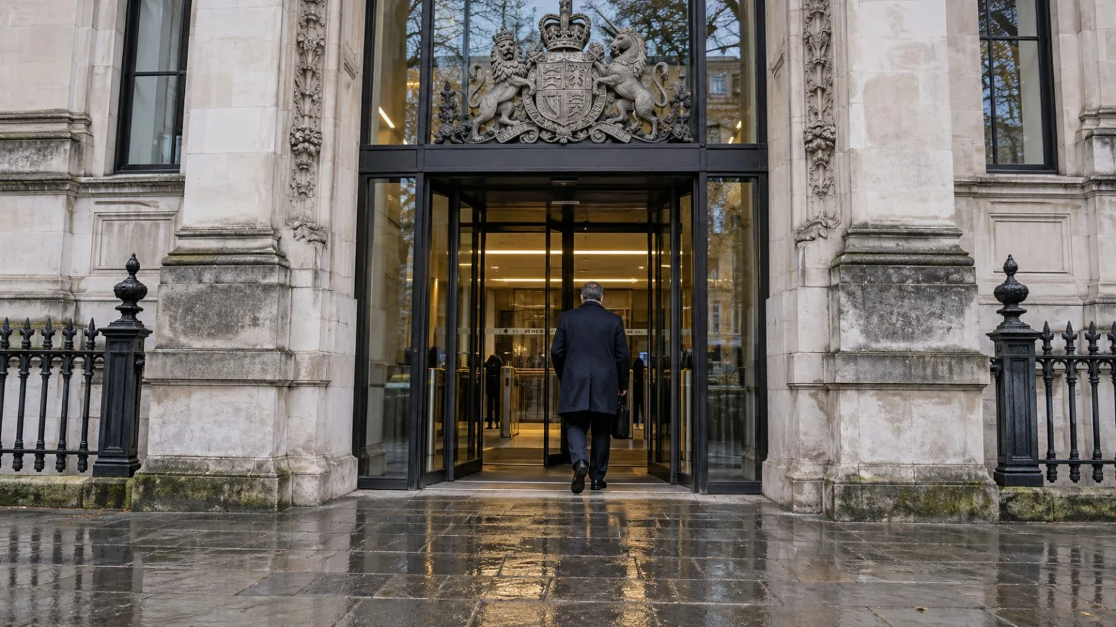 A visitor enters Westminster Magistrates’ Court in London on an overcast morning. (AI-generated image / EconoTimes)