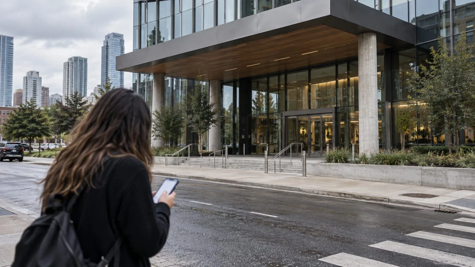 A voter checks a phone outside a polling station in New York City. / EconoTimes.ai