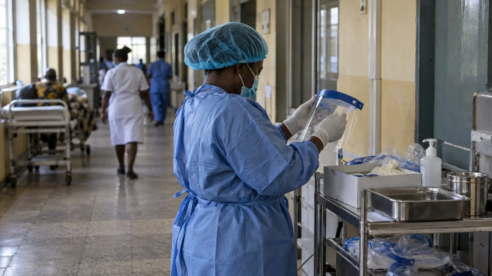 A clinician arranges protective equipment in a hospital corridor in Abeokuta, Ogun State, Nigeria. (AI-generated image / EconoTimes)