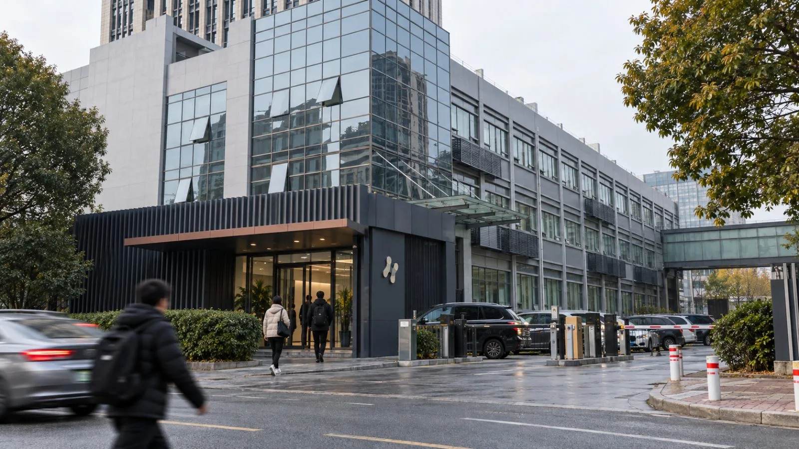 Pedestrians enter the Unitree Robotics headquarters in Hangzhou, China. / EconoTimes.ai