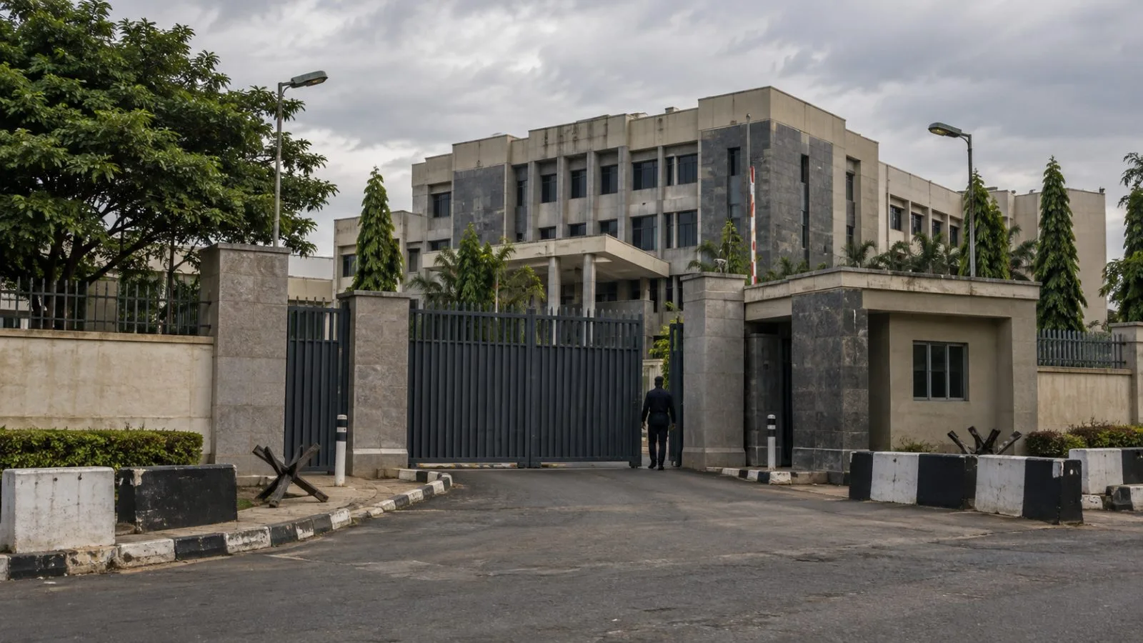A security gate stands outside the Civil Defence Corps headquarters in Abuja, Nigeria. (AI-generated image / EconoTimes)