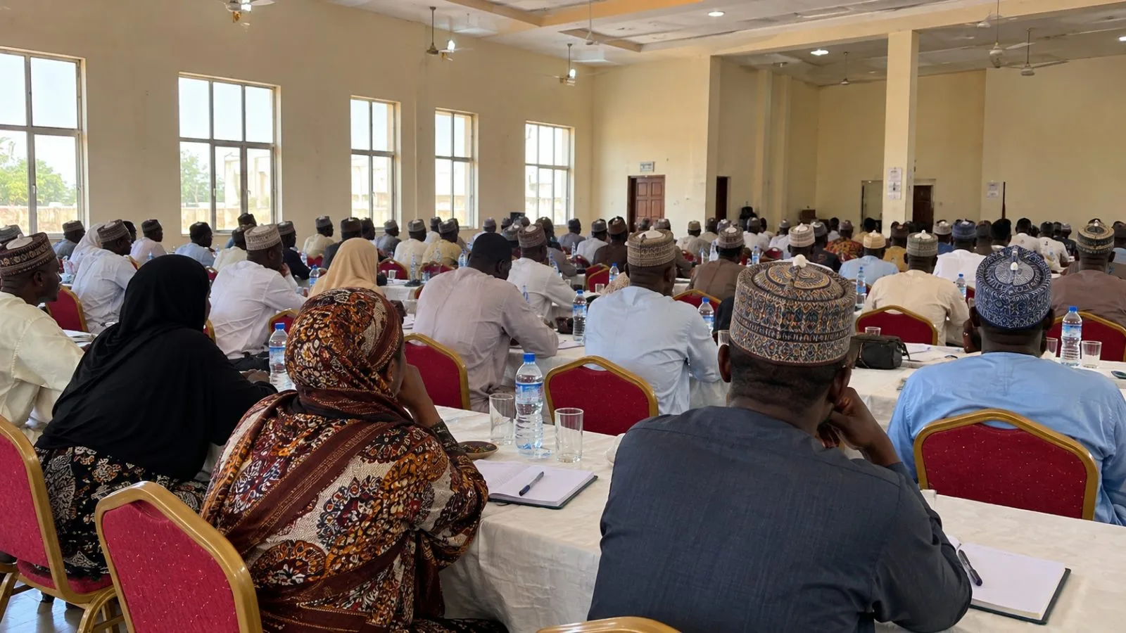 Exporters gather at a trade forum in a conference hall in Kano, Nigeria. (AI-generated image / EconoTimes)