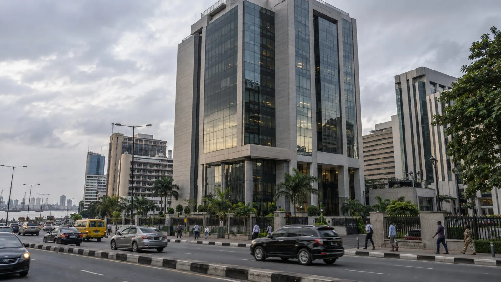 Office workers pass a commercial tower on Marina Road on Lagos Island, Nigeria. (AI-generated image / EconoTimes)