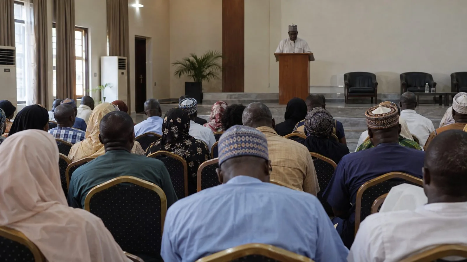 Attendees listen during a public health summit in Abuja, Nigeria. (AI-generated image / EconoTimes)