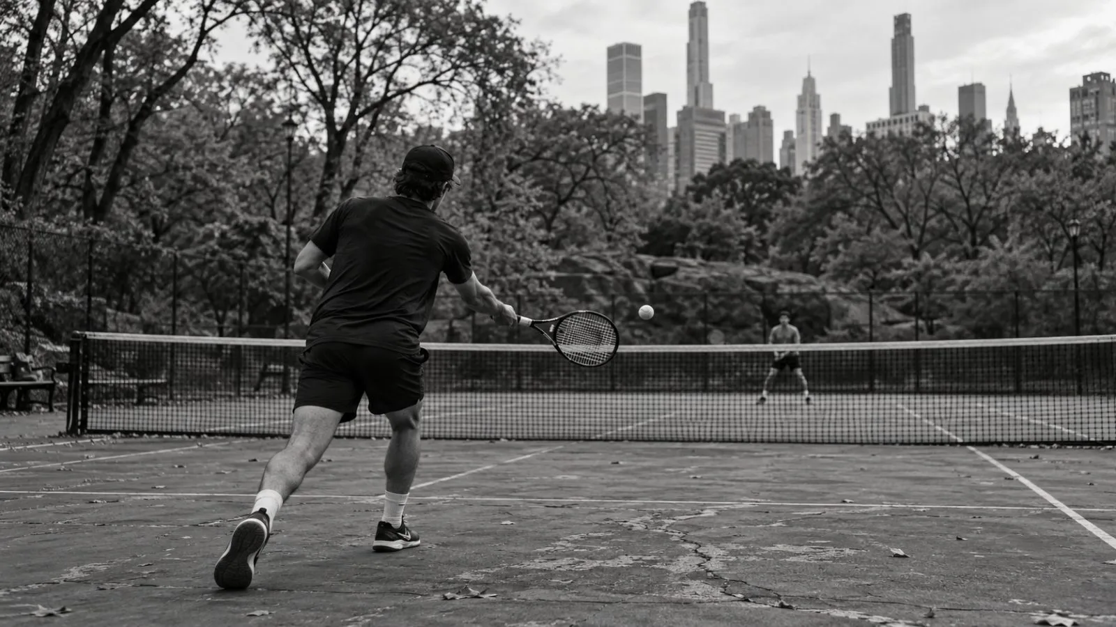 A tennis ball rests near the net at Central Park Tennis Center in New York. (AI-generated image / EconoTimes)