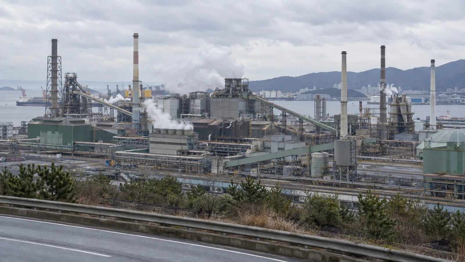 Industrial buildings and stacks stand at the Onsan copper smelter in Ulsan, South Korea. (AI-generated image / EconoTimes)