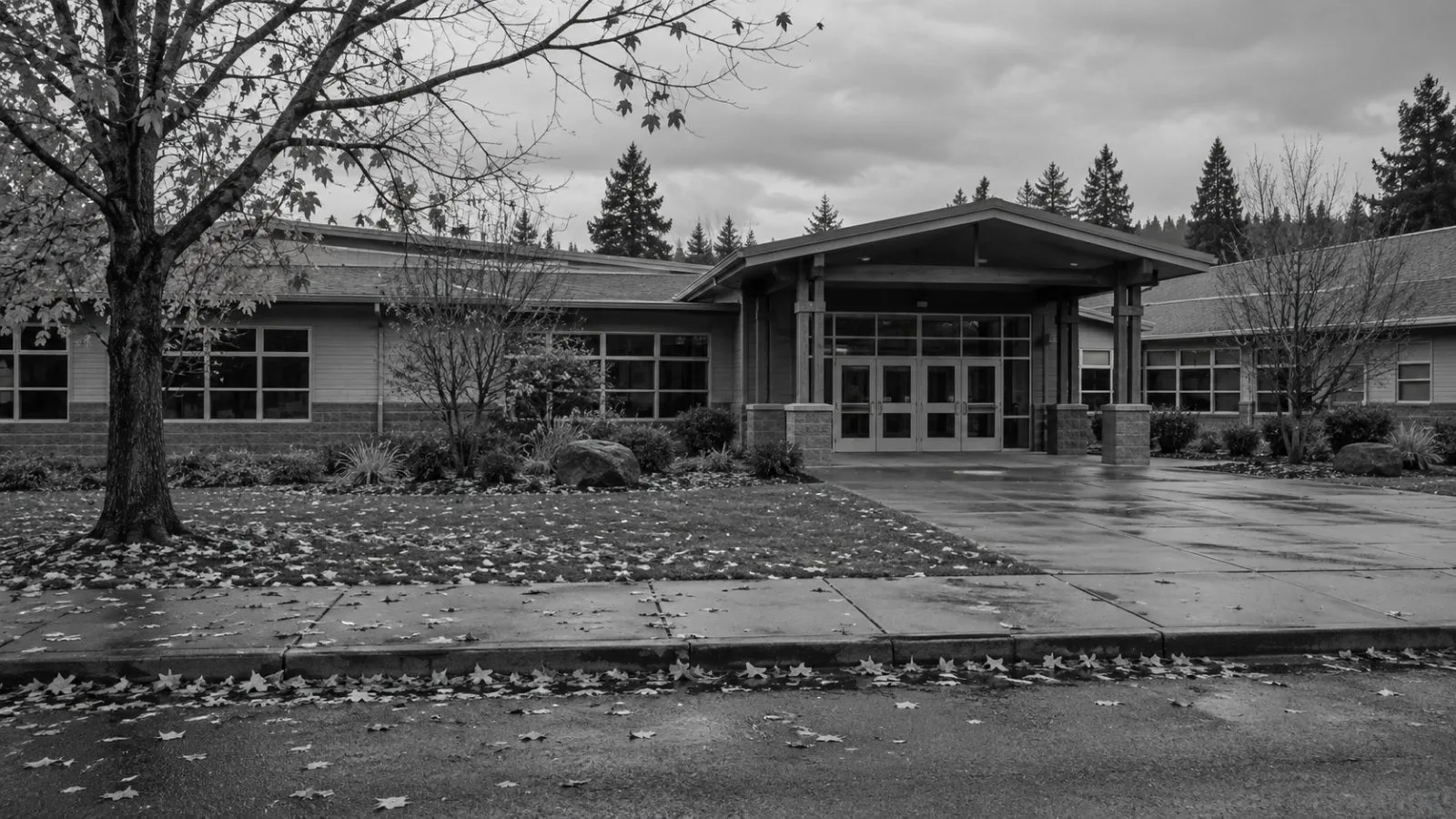 The entrance to Silver Rail Elementary School stands in Bend, Oregon, beneath an overcast sky. (AI-generated image / EconoTimes)