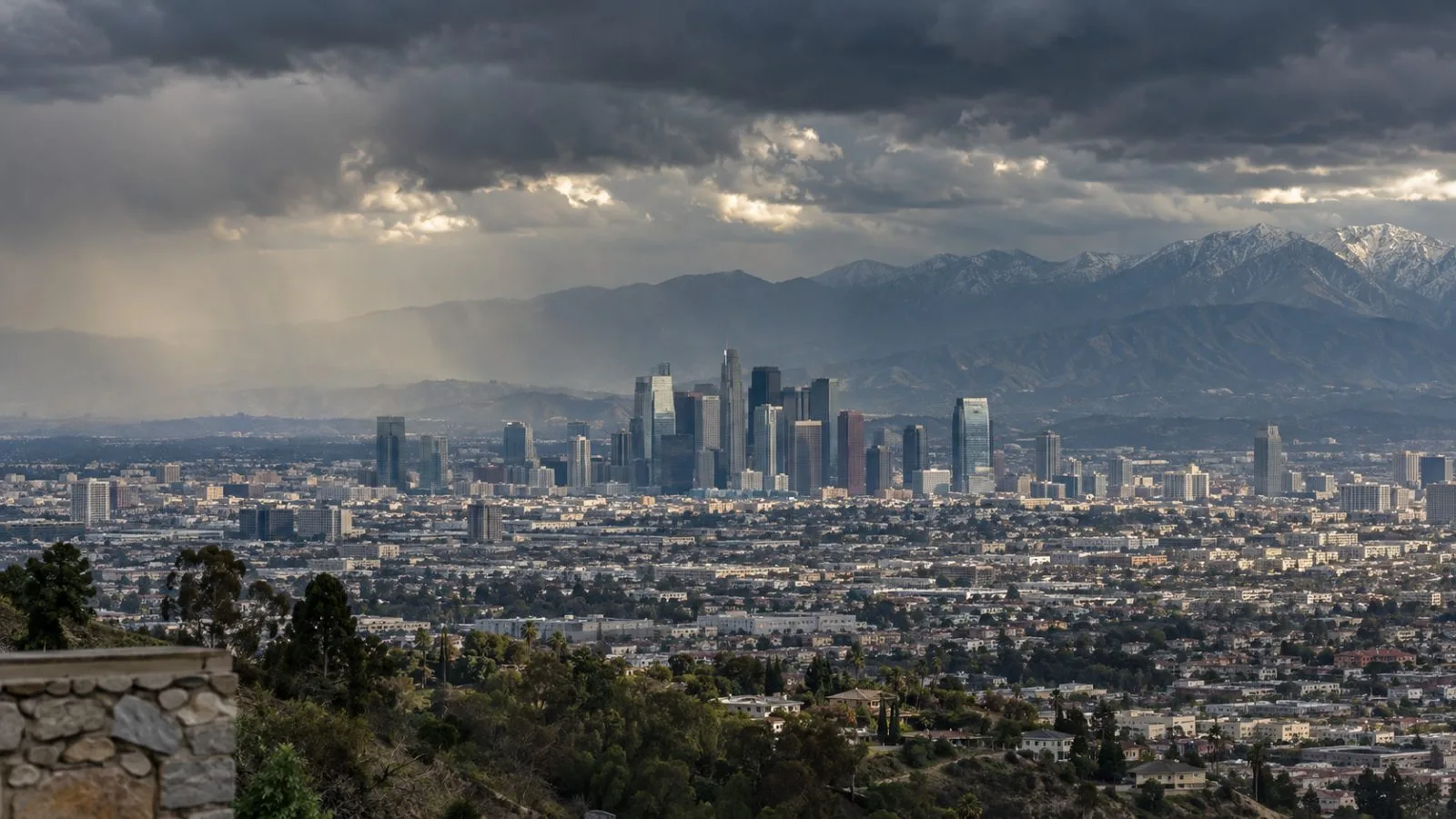 Storm clouds gather above the Los Angeles skyline in Southern California. (AI-generated image / EconoTimes)