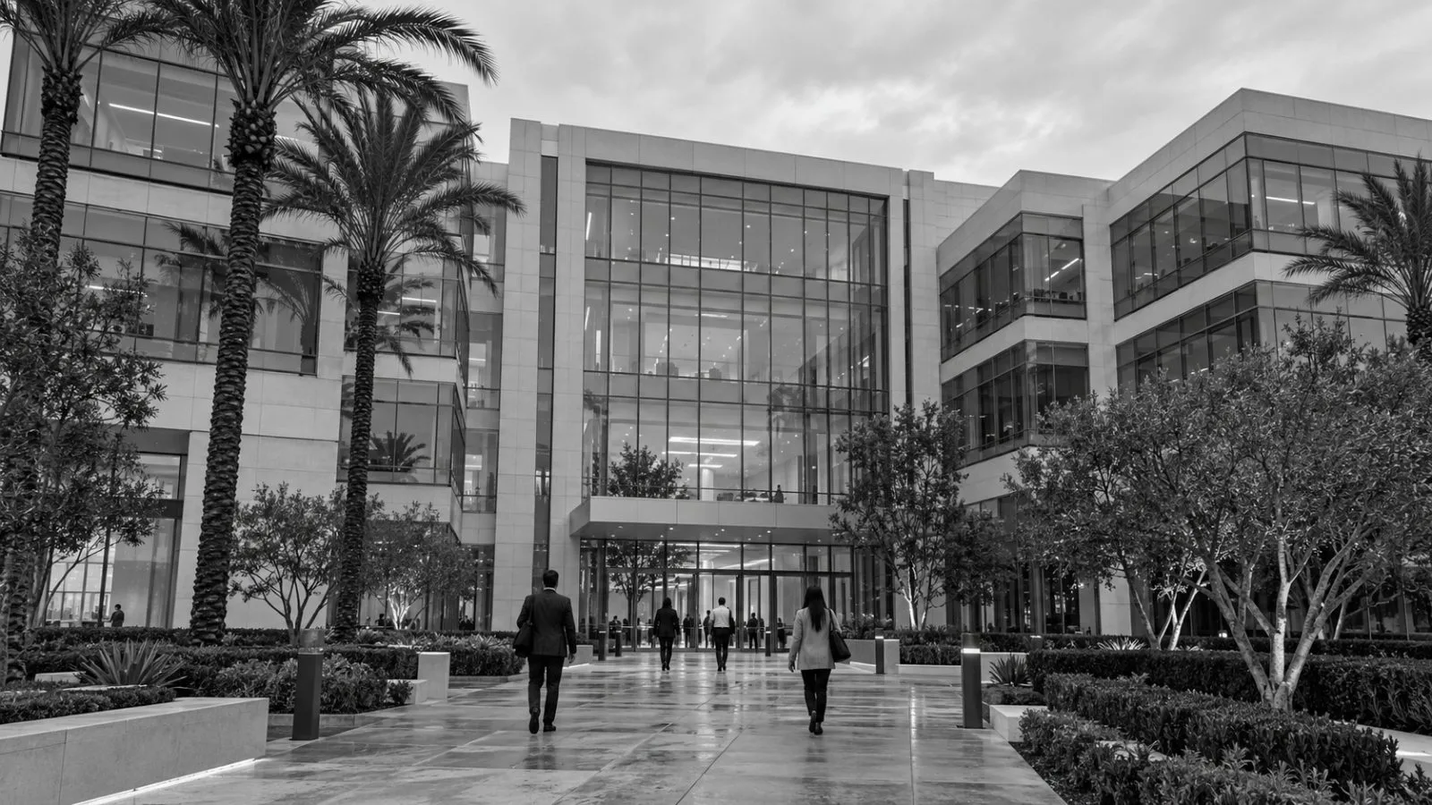 Pedestrians approach loanDepot's headquarters in Irvine, California, under an overcast sky. (AI-generated image / EconoTimes)