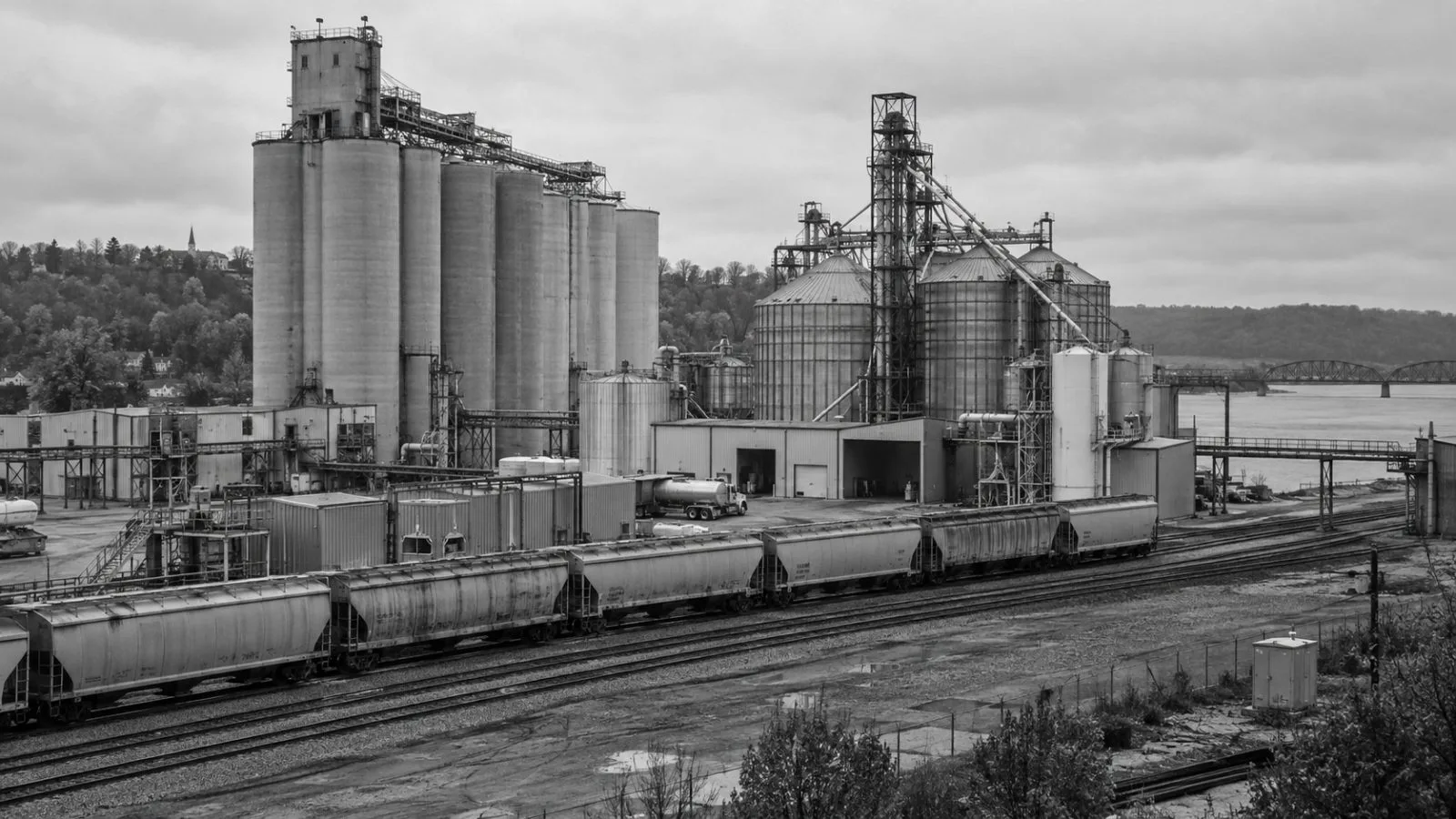 Grain silos rise beside an ingredient-processing facility in Atchison, Kansas. (AI-generated image / EconoTimes)