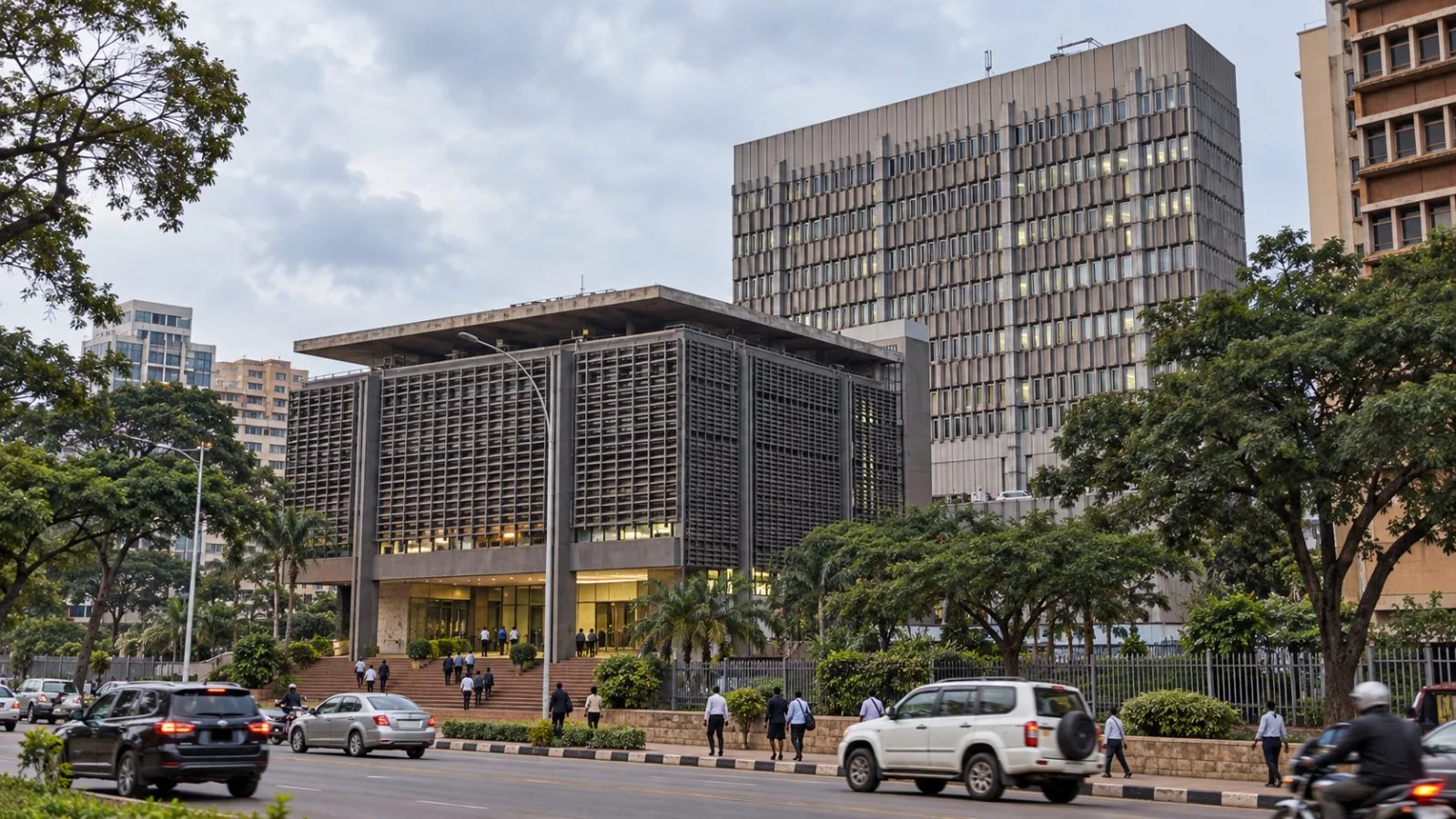 Visitors walk toward the Bank of Uganda headquarters in Kampala, Uganda. / EconoTimes.ai
