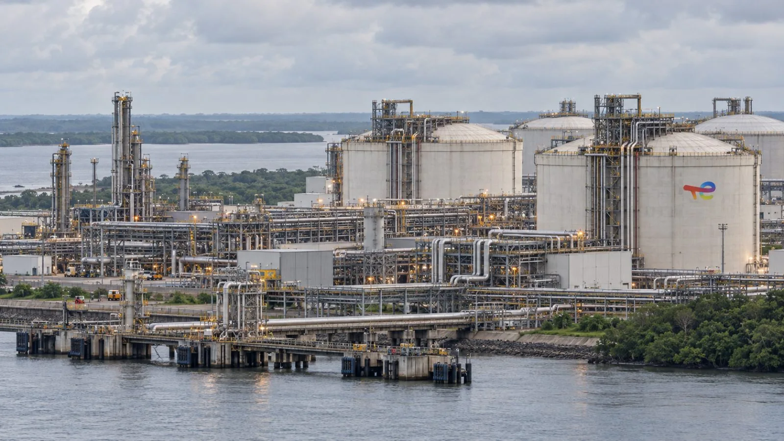 Storage tanks and pipelines stand at the Nigeria LNG facility on Bonny Island, Nigeria. / EconoTimes.ai