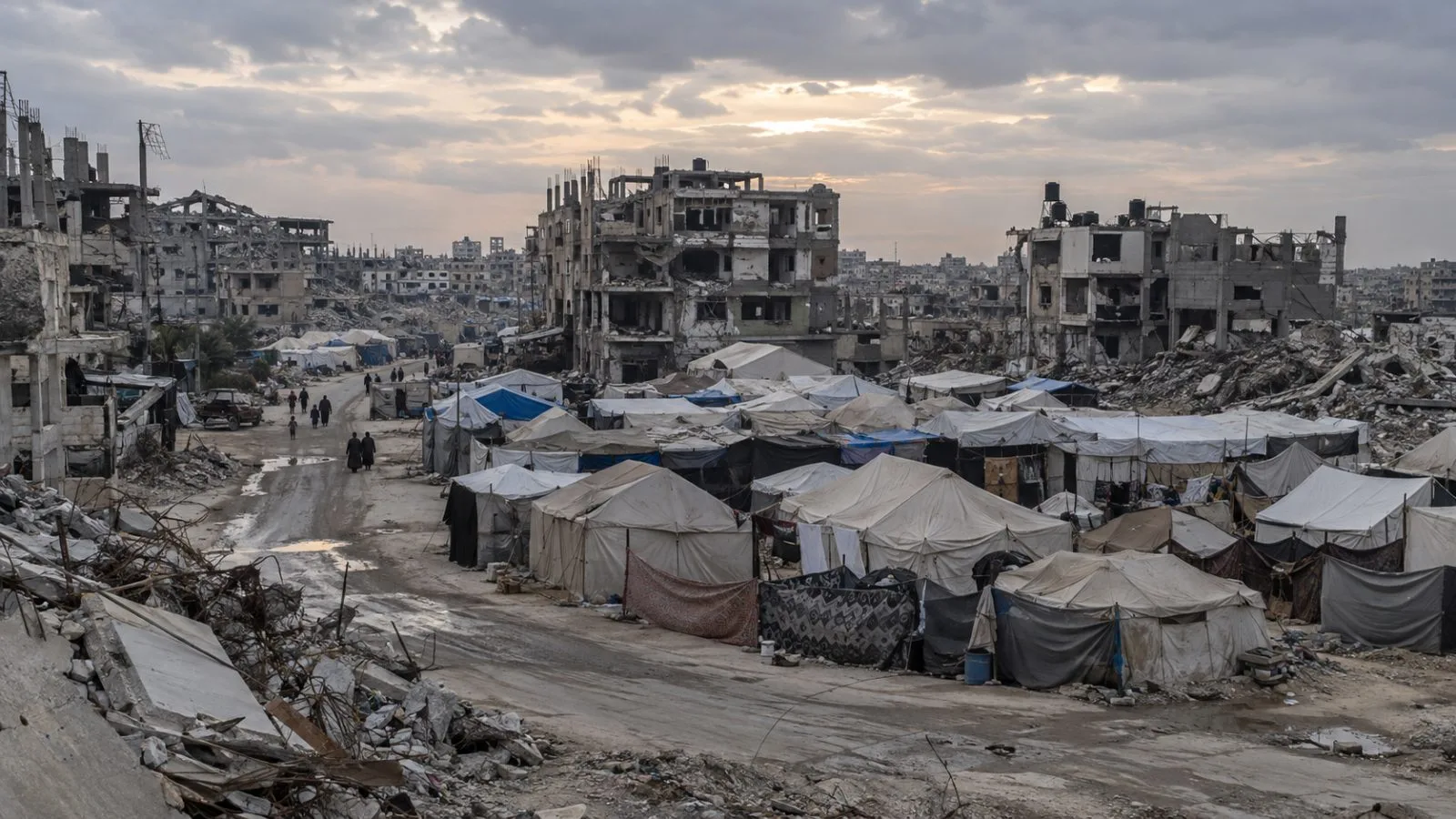 Displacement tents stand near damaged buildings in Al Shujaiyeh, Gaza City. (AI-generated image / EconoTimes)