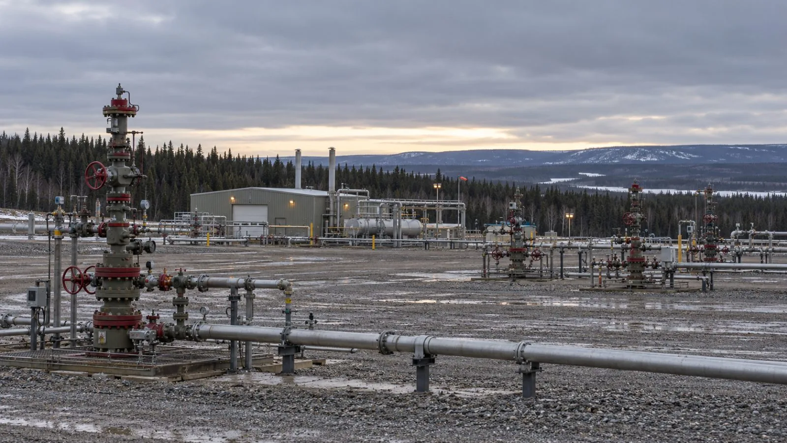 Gas production equipment stands on a well pad near Fort St. John, British Columbia. (AI-generated image / EconoTimes)