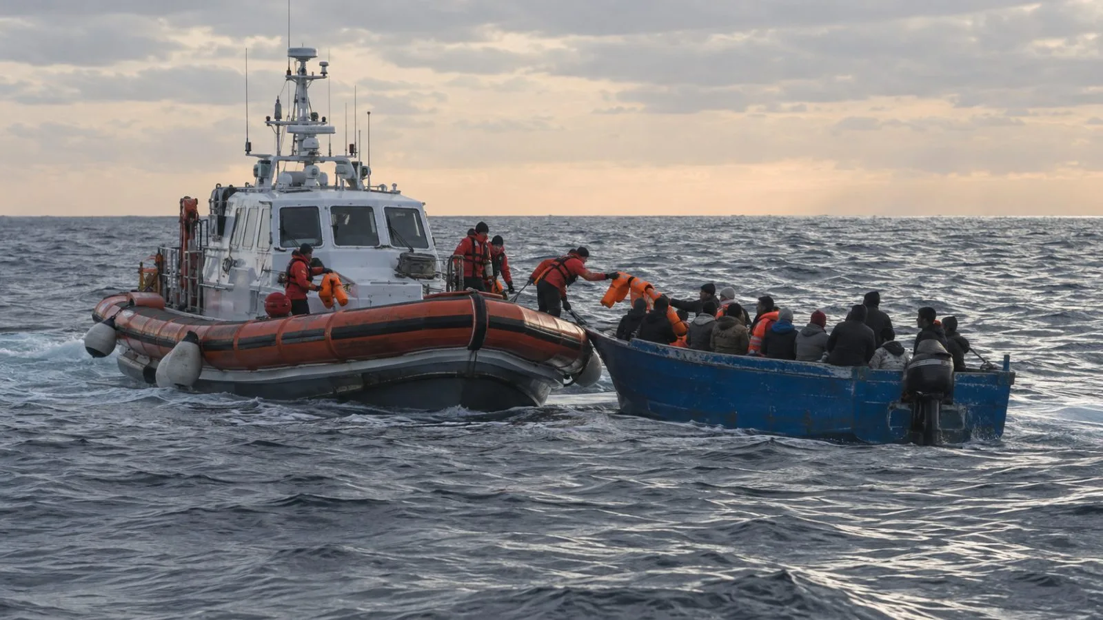 A coast guard vessel approaches a migrant boat off Lampedusa, Italy. (AI-generated image / EconoTimes)