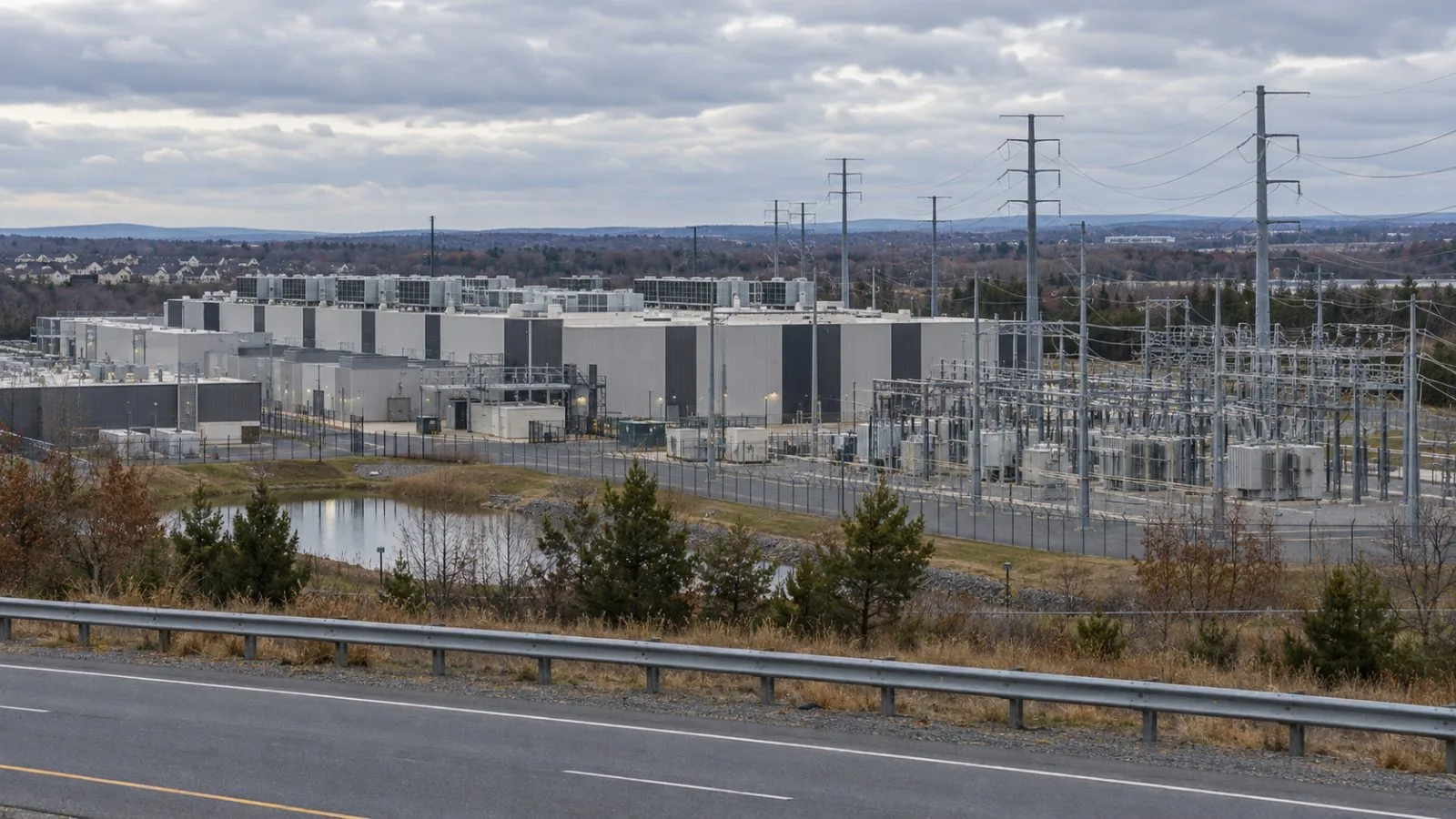 Transmission lines run beside a data center campus in Ashburn, Virginia. (AI-generated image / EconoTimes)