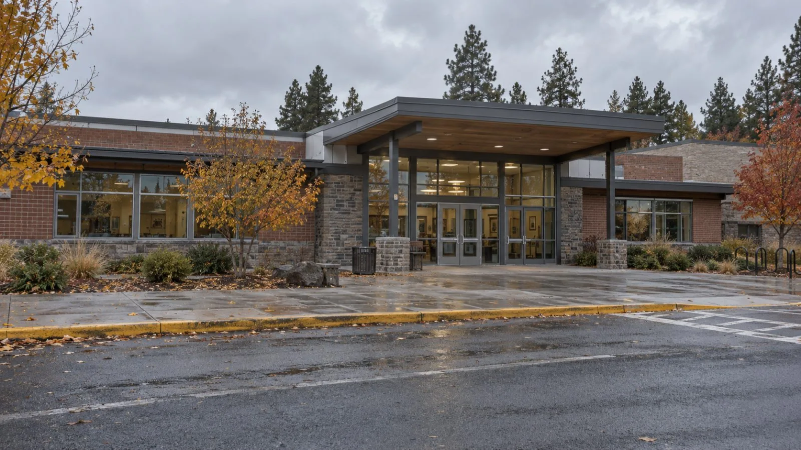 Glass entrance doors face the street at Silver Rail Elementary School in Bend, Oregon. (AI-generated image / EconoTimes)