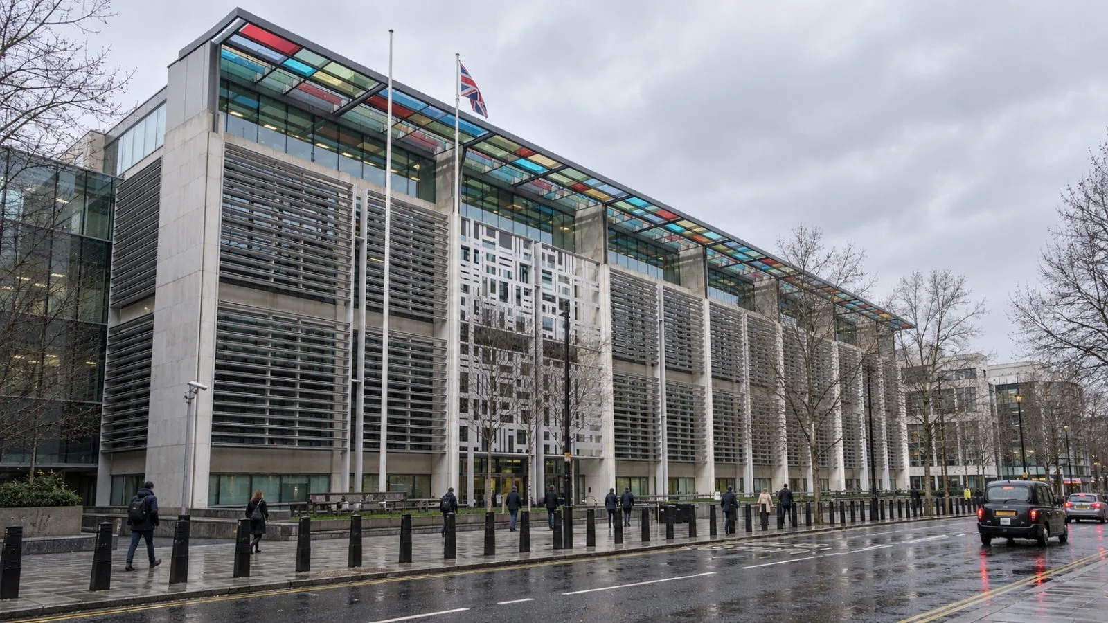Pedestrians pass the Home Office building on Marsham Street in London. / EconoTimes.ai