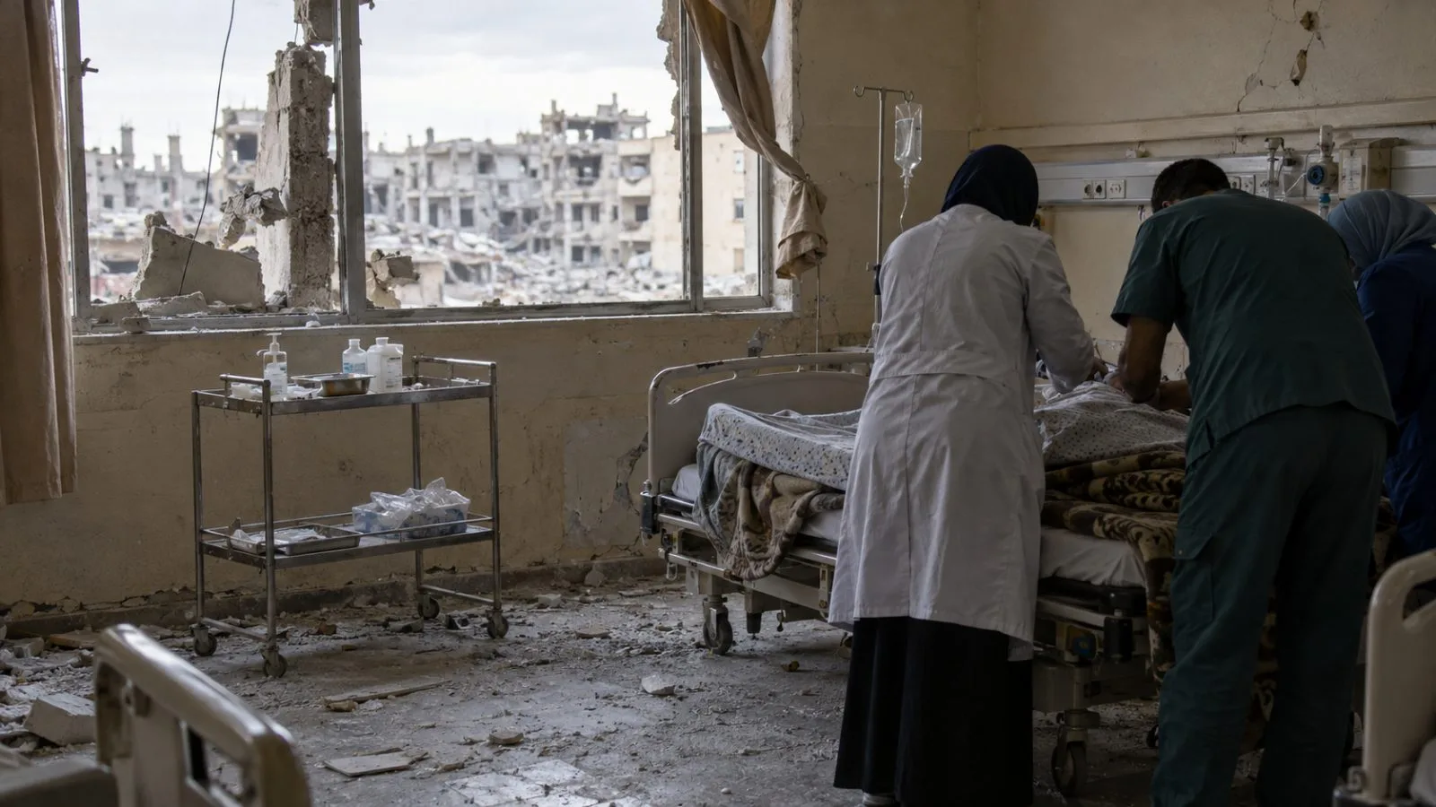 Medical workers attend a patient beside an empty trolley in a damaged Gaza City hospital. (AI-generated image / EconoTimes)