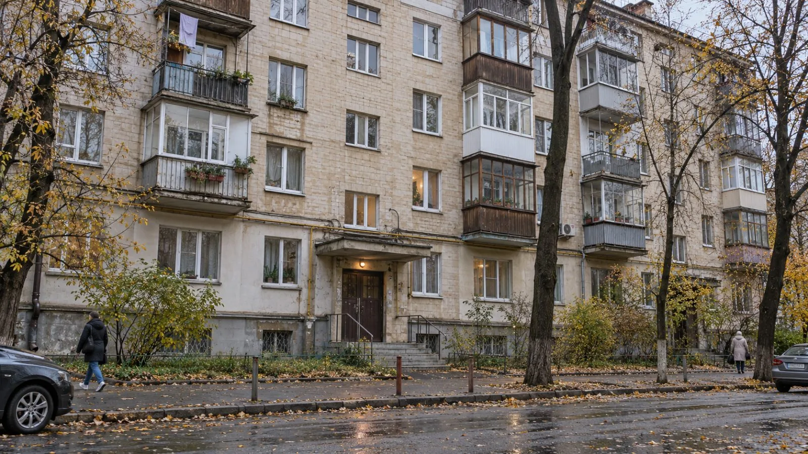A residential apartment block stands along a street in Kyiv, Ukraine, under overcast autumn skies. (AI-generated image / EconoTimes)