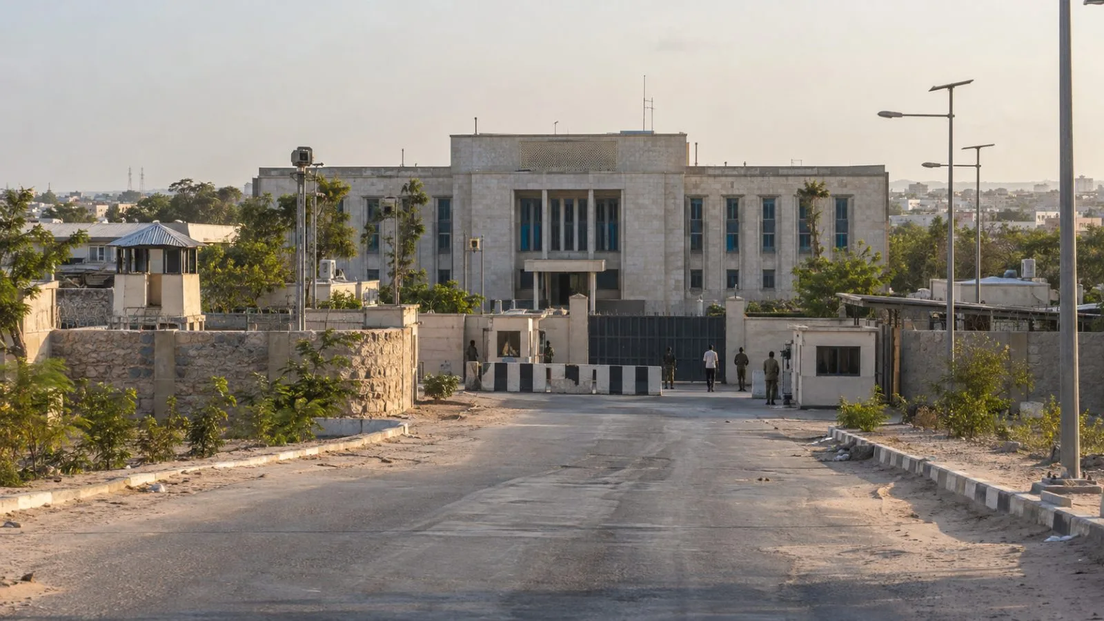 Somalia’s Defense Ministry compound sits along an entrance road in Mogadishu under hazy afternoon light. (AI-generated image / EconoTimes)