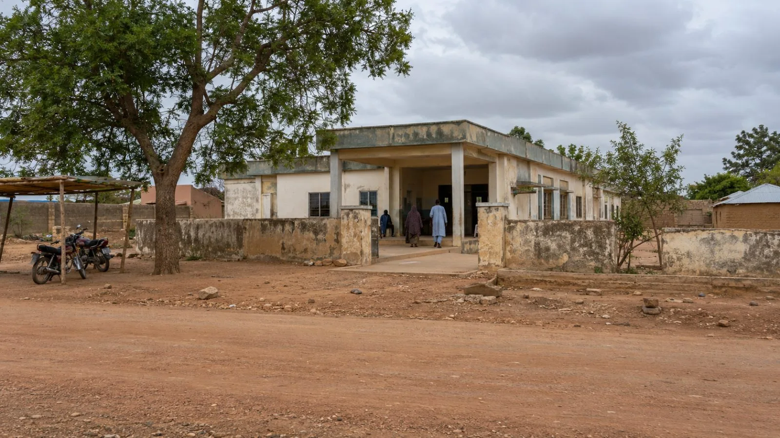The entrance to Bagega Clinic stands beside a dusty road in Zamfara State, Nigeria. (AI-generated image / EconoTimes)