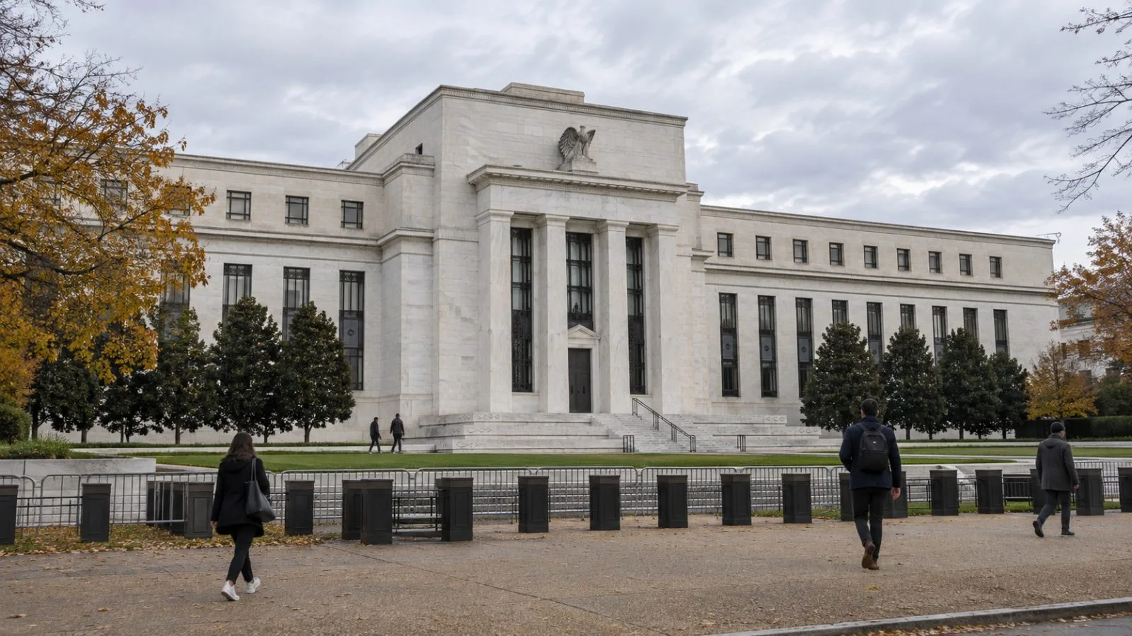 The Federal Reserve's Eccles Building stands behind security barriers in Washington, D.C. (AI-generated image / EconoTimes)