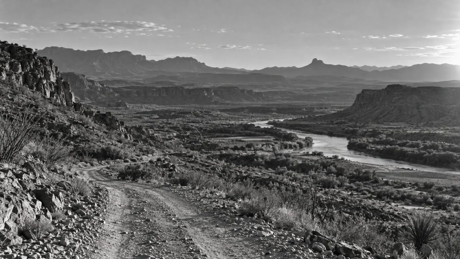 A dirt access road crosses rugged terrain near Big Bend National Park in Texas (AI-generated image / EconoTimes)