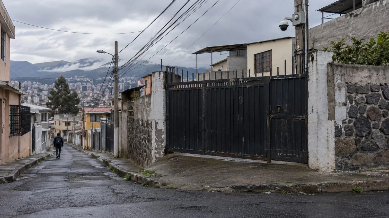 A security camera overlooks a gated side street in Solanda, Quito, Ecuador. (AI-generated image / EconoTimes)