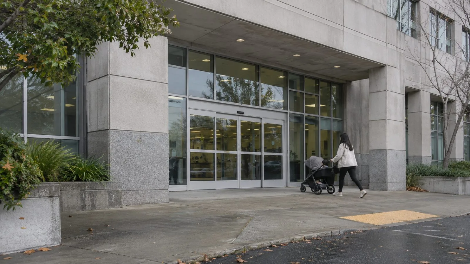 A visitor pushes a stroller past a state employment office in Sacramento, California (AI-generated image / EconoTimes)