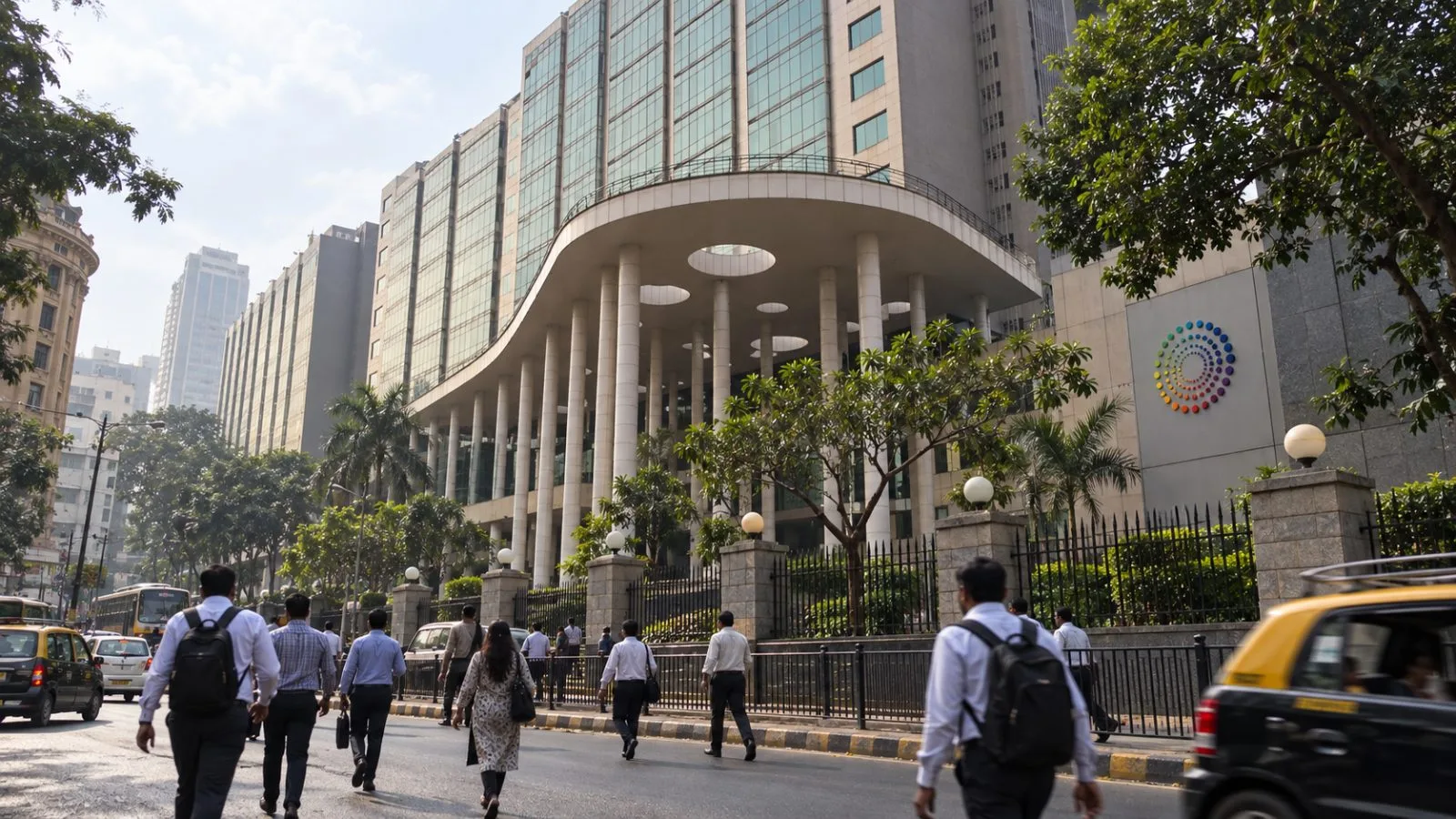 Commuters pass the Bombay Stock Exchange district in Mumbai during the trading day. / EconoTimes.ai