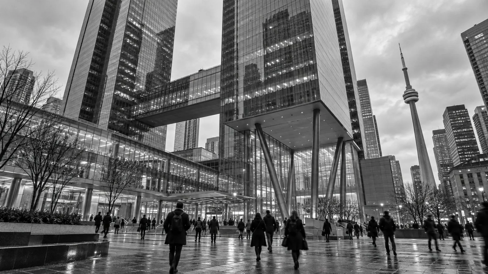 Pedestrians cross the plaza outside CIBC Square in Toronto on an overcast afternoon. / EconoTimes.ai
