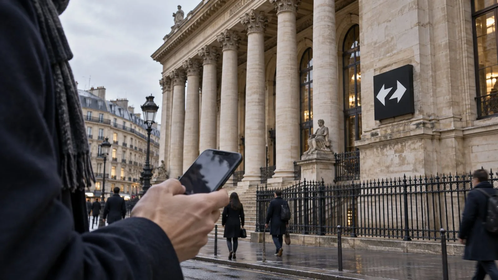 A passerby checks a smartphone outside the Palais Brongniart in Paris. / EconoTimes.ai