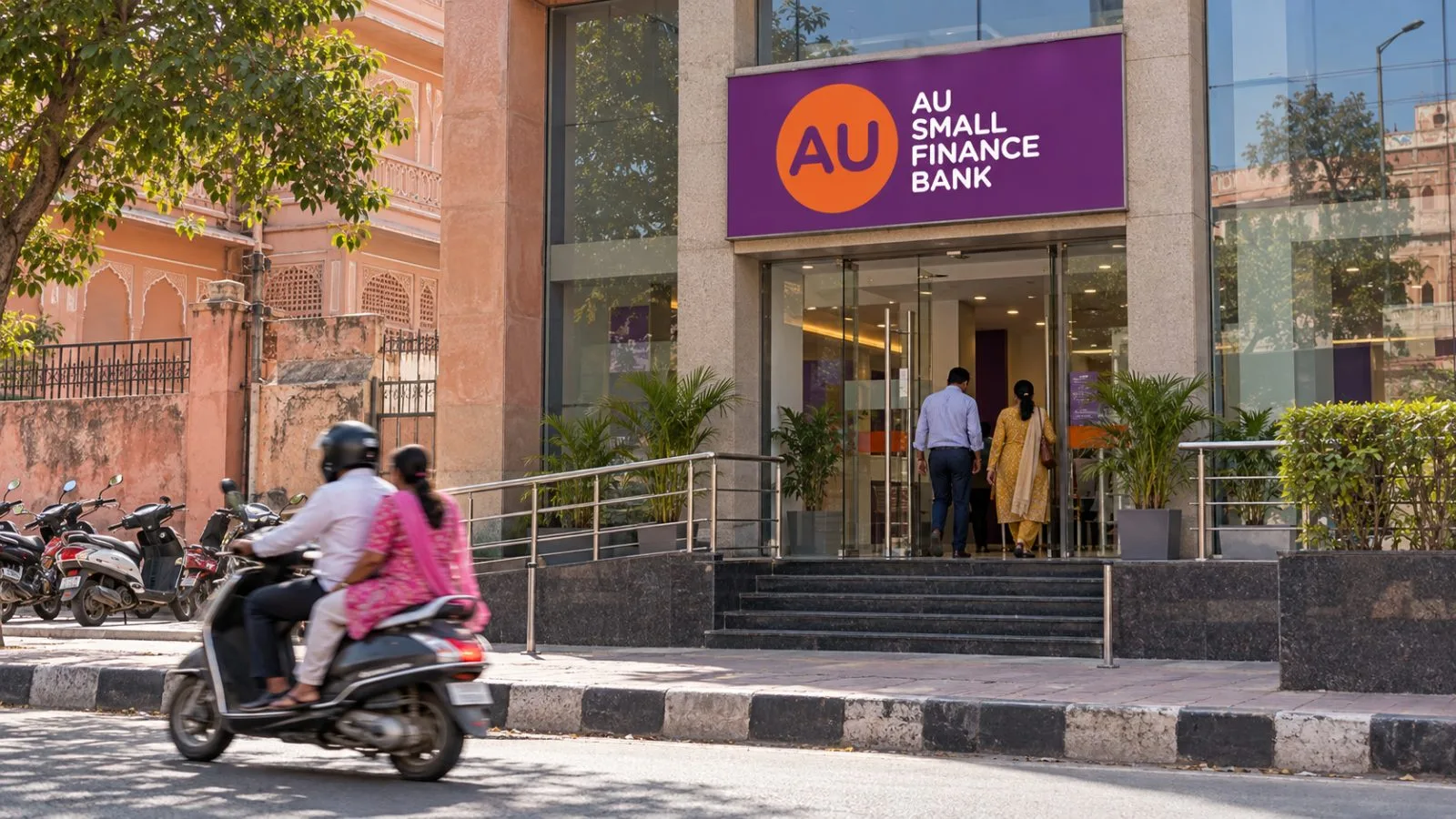 Customers enter a bank branch on a busy street in Jaipur, Rajasthan. / EconoTimes.ai